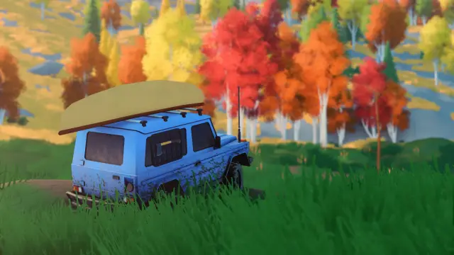 A blue vehicle with a roof canoe and patterned paintwork